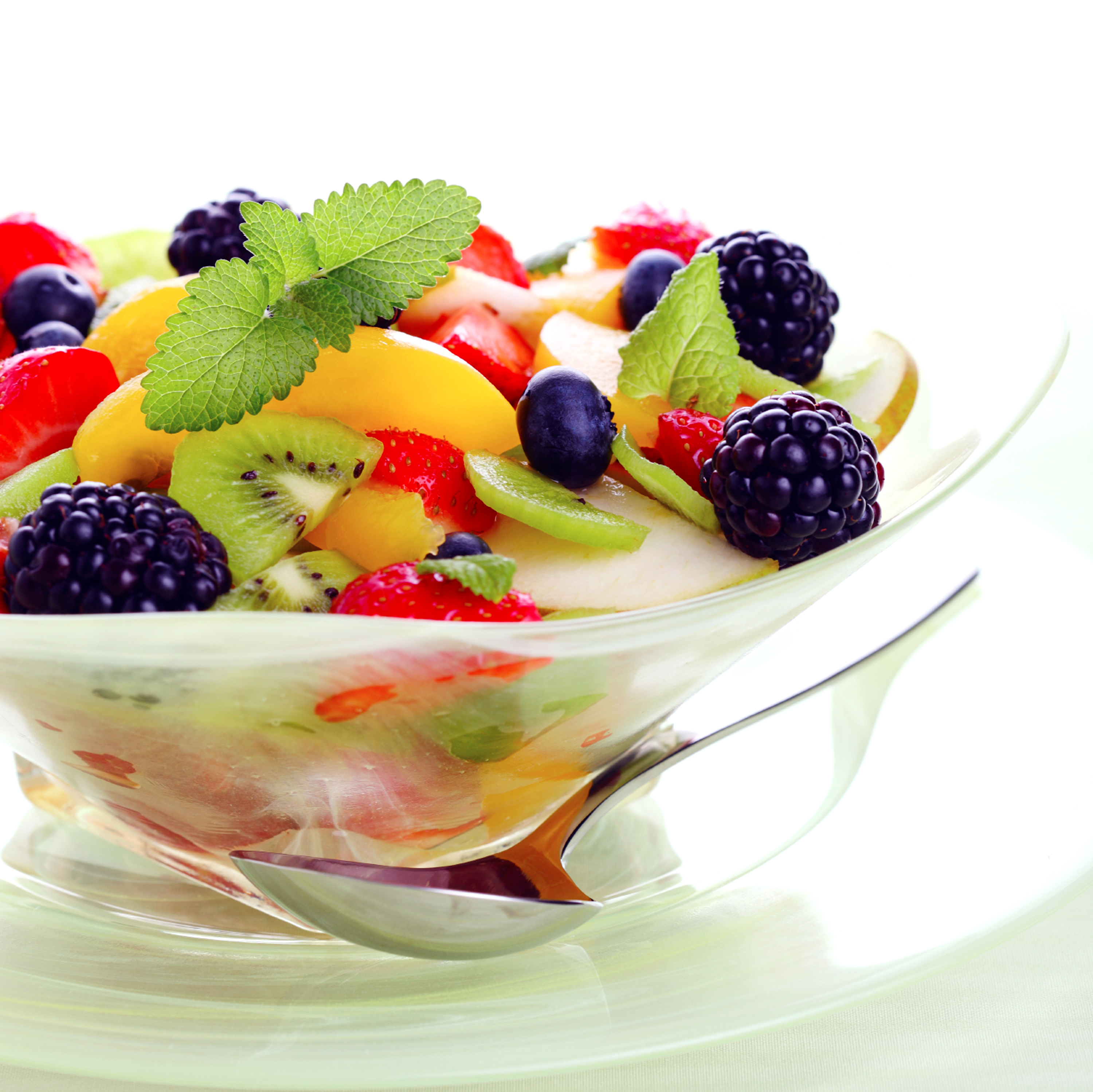 Fresh fruits salad on white background